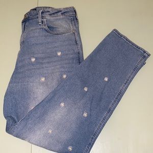 Ultra high rise mom jeans from Hollister with embroidered daisy details.